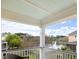 This charming balcony offers serene views of a tranquil lake and lush greenery in a picturesque setting at 138 Sandshell Dr, Charleston, SC 29492