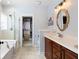 Bright bathroom featuring a glass-enclosed shower, wood vanity, and walk-in closet at 138 Sandshell Dr, Charleston, SC 29492
