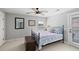 Inviting bedroom featuring a cozy bed, natural light, and a ceiling fan at 138 Sandshell Dr, Charleston, SC 29492