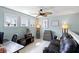 A versatile bonus room features natural light, comfortable seating, and stylish decor at 138 Sandshell Dr, Charleston, SC 29492
