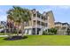 Beautiful two-story home with dual balconies, well-manicured lawn and a two car garage at 138 Sandshell Dr, Charleston, SC 29492