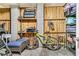 Unfinished garage featuring wooden plank walls, block columns, seating, and bicycle storage at 138 Sandshell Dr, Charleston, SC 29492