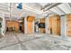 Spacious unfinished garage with concrete floor, block walls and overhead door providing parking and storage at 138 Sandshell Dr, Charleston, SC 29492