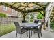 Outdoor gazebo with dining table and chairs, perfect for enjoying meals and gatherings in the backyard at 138 Sandshell Dr, Charleston, SC 29492