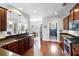 Modern kitchen with stainless appliances, hardwood floors, and a view to dining room at 138 Sandshell Dr, Charleston, SC 29492