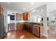 Open concept kitchen with granite countertops and stainless steel appliances flows into the cozy living room at 138 Sandshell Dr, Charleston, SC 29492