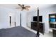 Primary bedroom featuring an ensuite bathroom, TV, walk-in closet, and lots of natural light at 138 Sandshell Dr, Charleston, SC 29492