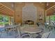 The outdoor pavilion features a brick fireplace, ceiling fans and tables for gatherings at 138 Sandshell Dr, Charleston, SC 29492