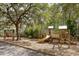 Community playground with a swing set, climbing structures, and a slide for outdoor activities at 138 Sandshell Dr, Charleston, SC 29492