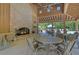 Cozy fireplace in open pavilion is a great place to relax and watch a game by the pool at 138 Sandshell Dr, Charleston, SC 29492
