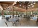 Large outdoor pavilion with ample seating offers the perfect place to relax or meet friends by the pool at 138 Sandshell Dr, Charleston, SC 29492