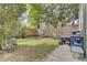 Well-kept backyard featuring a privacy fence, green space, and gravel area at 1406 Iroquois St, North Charleston, SC 29405
