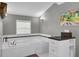 Bathroom features a soaking tub, wall art and white tiled finishes at 1406 Iroquois St, North Charleston, SC 29405