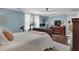 Bedroom with hardwood floors and ceiling fan showcasing large dresser and desk area at 1406 Iroquois St, North Charleston, SC 29405