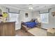 Cozy bedroom with wood floors, ceiling fan, natural light and decor at 1406 Iroquois St, North Charleston, SC 29405