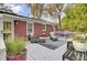 Charming deck area with lounge chairs, a hammock, and lush greenery at 1406 Iroquois St, North Charleston, SC 29405
