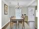 Dining room with hardwood floors, natural light, and a classic chandelier at 1406 Iroquois St, North Charleston, SC 29405
