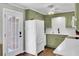 Bright eat-in kitchen with stainless appliances, white countertops, and a door to the outdoor area at 1406 Iroquois St, North Charleston, SC 29405
