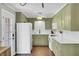 The eat-in kitchen features classic cabinets, modern appliances, and bright white countertops at 1406 Iroquois St, North Charleston, SC 29405