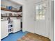 Convenient laundry room offers a utility sink, shelving, and storage space at 1406 Iroquois St, North Charleston, SC 29405