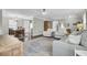 Open-concept living area showcasing hardwood floors and seamless transitions to dining and entry at 1406 Iroquois St, North Charleston, SC 29405
