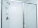 Modern bathroom shower featuring white subway tile and glass door at 143 Brant Dr, Summerville, SC 29483