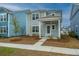 Charming two-story home with a covered porch and neutral siding, complemented by a well-maintained front yard at 143 Brant Dr, Summerville, SC 29483