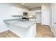 Well-lit kitchen featuring stylish white cabinetry, granite countertops, and modern fixtures, with hardwood flooring at 143 Brant Dr, Summerville, SC 29483