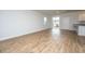 Bright and airy living space featuring pristine hardwood floors, a sliding glass door, and ample natural light at 143 Brant Dr, Summerville, SC 29483