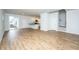 Open-concept floor plan showcasing the hardwood floors connecting the living area to the kitchen and staircase at 143 Brant Dr, Summerville, SC 29483