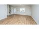 Spacious living room with wood-look flooring and a large window at 143 Brant Dr, Summerville, SC 29483