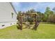 Beautiful backyard with a custom pergola, swing, and a fire pit at 1433 Oakhurst Dr, Mount Pleasant, SC 29466
