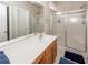 Bright bathroom featuring a large mirror, vanity with storage, and walk-in shower at 1433 Oakhurst Dr, Mount Pleasant, SC 29466