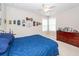 Bedroom with a blue comforter, dresser and collectables on display at 1433 Oakhurst Dr, Mount Pleasant, SC 29466