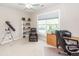 Bright bedroom featuring a large window, a ceiling fan, and a cozy brown leather chair at 1433 Oakhurst Dr, Mount Pleasant, SC 29466