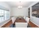 Formal dining room with a dark wood table, six upholstered chairs, and a chandelier at 1433 Oakhurst Dr, Mount Pleasant, SC 29466