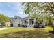 Inviting home featuring a lovely front yard with mature trees and a classic design at 1433 Oakhurst Dr, Mount Pleasant, SC 29466