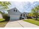 Charming two-story home with a well-maintained lawn and attached garage at 1433 Oakhurst Dr, Mount Pleasant, SC 29466