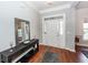 Welcoming foyer with hardwood floors, decorative mirror, and a stylish console table at 1433 Oakhurst Dr, Mount Pleasant, SC 29466
