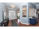 Inviting entryway with wood floors, console table, and view into the adjacent dining room at 1433 Oakhurst Dr, Mount Pleasant, SC 29466