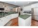 Spacious open kitchen with white cabinets, green counters, stainless steel appliances, and center island at 1433 Oakhurst Dr, Mount Pleasant, SC 29466