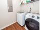 Laundry room featuring modern washer and dryer, with laminate wood-look flooring at 1433 Oakhurst Dr, Mount Pleasant, SC 29466