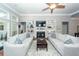 Bright living room with a fireplace, built-in shelving, and hardwood floors at 1433 Oakhurst Dr, Mount Pleasant, SC 29466