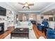 Open-concept living space connecting to the dining area and kitchen, with hardwood floors at 1433 Oakhurst Dr, Mount Pleasant, SC 29466