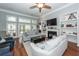 Spacious living room featuring a fireplace, built-in shelves, and comfortable seating at 1433 Oakhurst Dr, Mount Pleasant, SC 29466