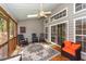 Cozy screened porch with rocking chairs and view of the landscaped yard at 1433 Oakhurst Dr, Mount Pleasant, SC 29466