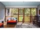 Inviting screened porch with comfortable seating and a view of the backyard at 1433 Oakhurst Dr, Mount Pleasant, SC 29466