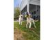 Backyard featuring grassy area and two dogs at 1586 Innkeeper Ln, Johns Island, SC 29455