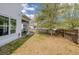A cozy backyard featuring a lush lawn, mature shade trees, and ample privacy from neighboring homes at 1586 Innkeeper Ln, Johns Island, SC 29455