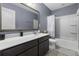 Bathroom with a white tub and shower combination, gray walls, and a dark wood vanity cabinet at 1586 Innkeeper Ln, Johns Island, SC 29455